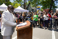 Ron Isley speaks to members of the community during a street renaming ceremony, Thursday, June 24, 2021, in Teaneck, N.J. Two New Jersey towns have renamed streets in honor of the Isley Brothers, the legendary R&B group that behind songs such as, "Shout," "Twist and Shout" and "It's Your Thing." Ron Isley and Ernie Isley attended separate ceremonies Thursday in Teaneck and Englewood, neighboring towns outside New York City where they lived during the band's heyday in the 1960s. (AP Photo/Mary Altaffer)