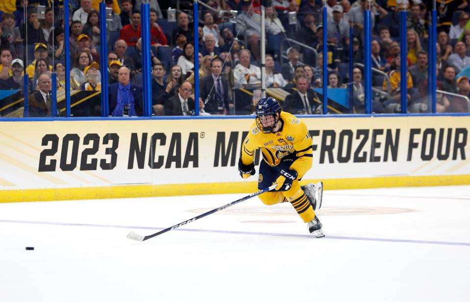 Collin Graf of the Quinnipiac Bobcats looks to pass in the second period during a semifinal of the 2023 Frozen Four against the Michigan Wolverines at Amalie Arena in Tampa, Florida, on Thursday, April 6, 2023.