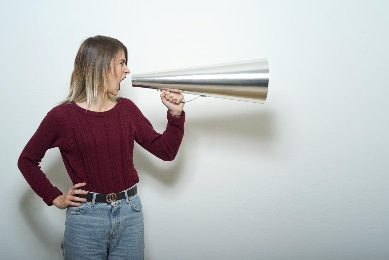 <span class="caption">A Supreme Court ruling on free speech does nothing about toxic online discourse.</span> <span class="attribution"><a class="link " href="https://www.gettyimages.com/detail/photo/young-woman-shouts-with-megaphone-royalty-free-image/1310062074" rel="nofollow noopener" target="_blank" data-ylk="slk:Francesco Carta fotografo/Moment via Getty Images;elm:context_link;itc:0;sec:content-canvas">Francesco Carta fotografo/Moment via Getty Images</a></span>