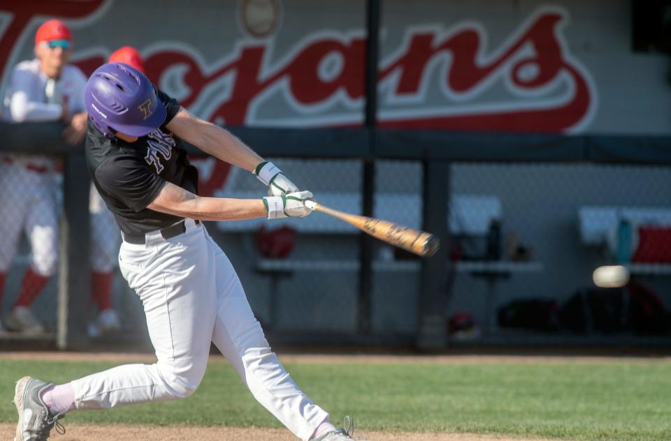 Tokays' Brett Graddy hits a single during a varsity baseball game  at Lincoln in Stockton on Wednesday, Apr.19, 2023.