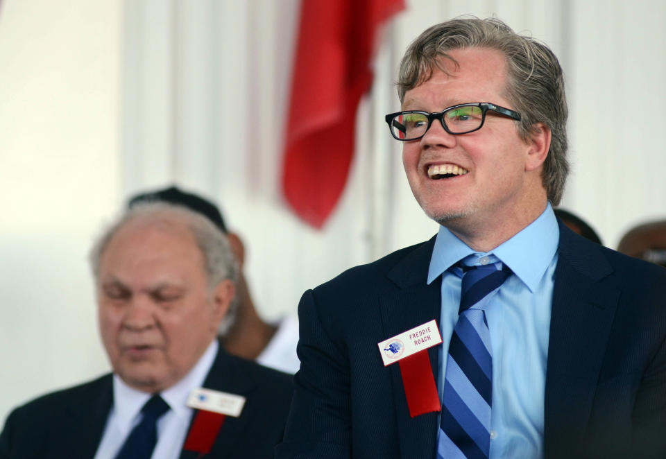 An International Boxing Hall of Fame inductee, trainer Freddie Roach, right, listens during the induction ceremony in Canastota, N.Y., Sunday, June 10, 2012. (AP Photo/Heather Ainsworth)