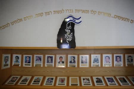 Photographs of soldiers who were killed in battles and were graduates of the Bnei David academy, the first religious military prep school and Jewish seminary, are displayed in a memorial at the academy in the West Bank Jewish settlement of Eli January 31, 2016. REUTERS/Ronen Zvulun