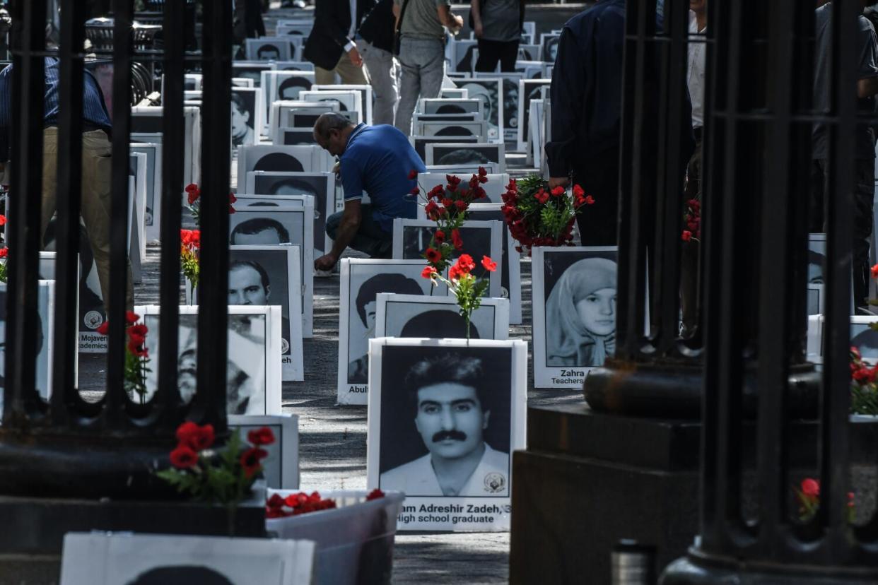 An exhibit of portraits of alleged victims of Iranian state violence set up near the United Nations on Tuesday.