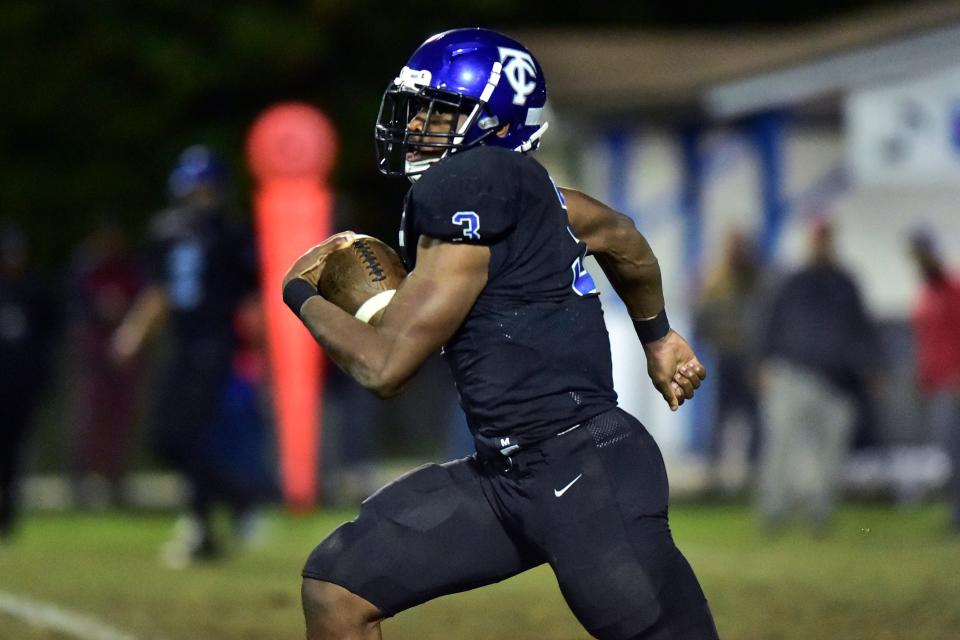 Trinity Christian running back Treyaun Webb (3) rushes for over 90 years on this play down to the 1-yard line during the fourth quarter Friday, Nov. 26, 2021 in Jacksonville. Trinity Christian and Quincy Munroe faced off during an FHSAA 2A Region 1 Championship. Trinity defeated Munroe 39-22 and advance to the final four.