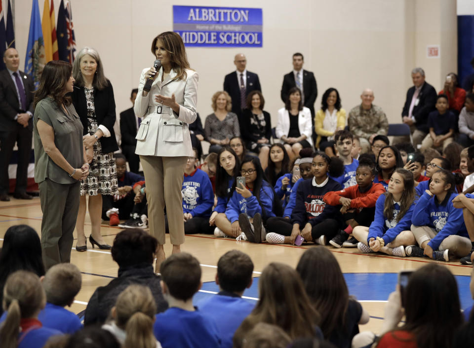 First lady Melania Trump, right, and second lady Karen Pence, left, speak to students at Albritton Middle School in Fort Bragg, N.C., Monday, April 15, 2019. (AP Photo/Chuck Burton)