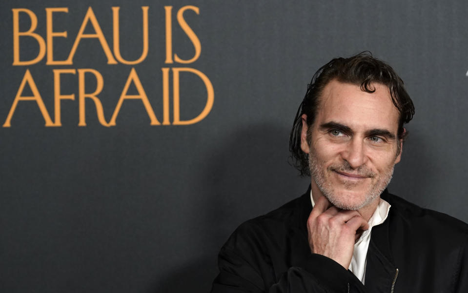 Joaquin Phoenix, star of the film "Beau Is Afraid," poses at the premiere of the film, Monday, April 10, 2023, at the Directors Guild of America in Los Angeles. (AP Photo/Chris Pizzello)