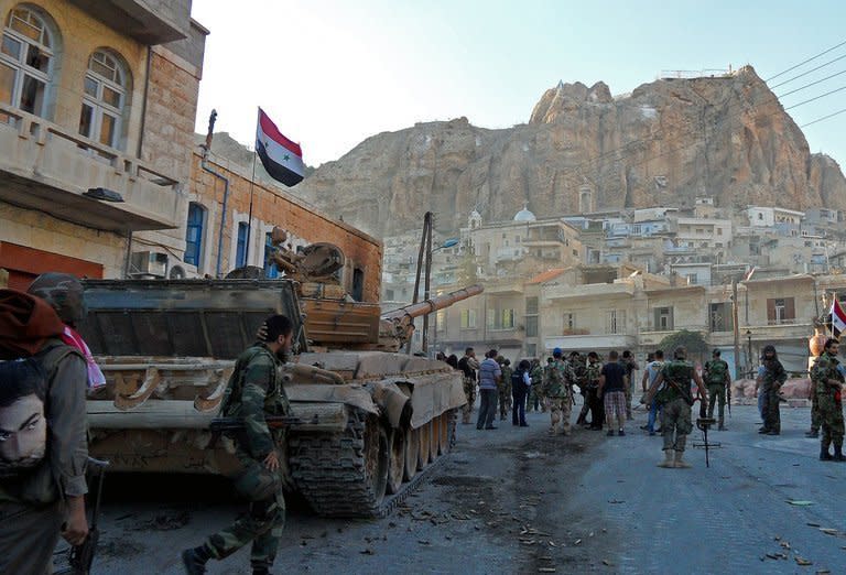 Syrian pro-government troops are seen on the streets of the Christian town of Maalula on September 11, 2013