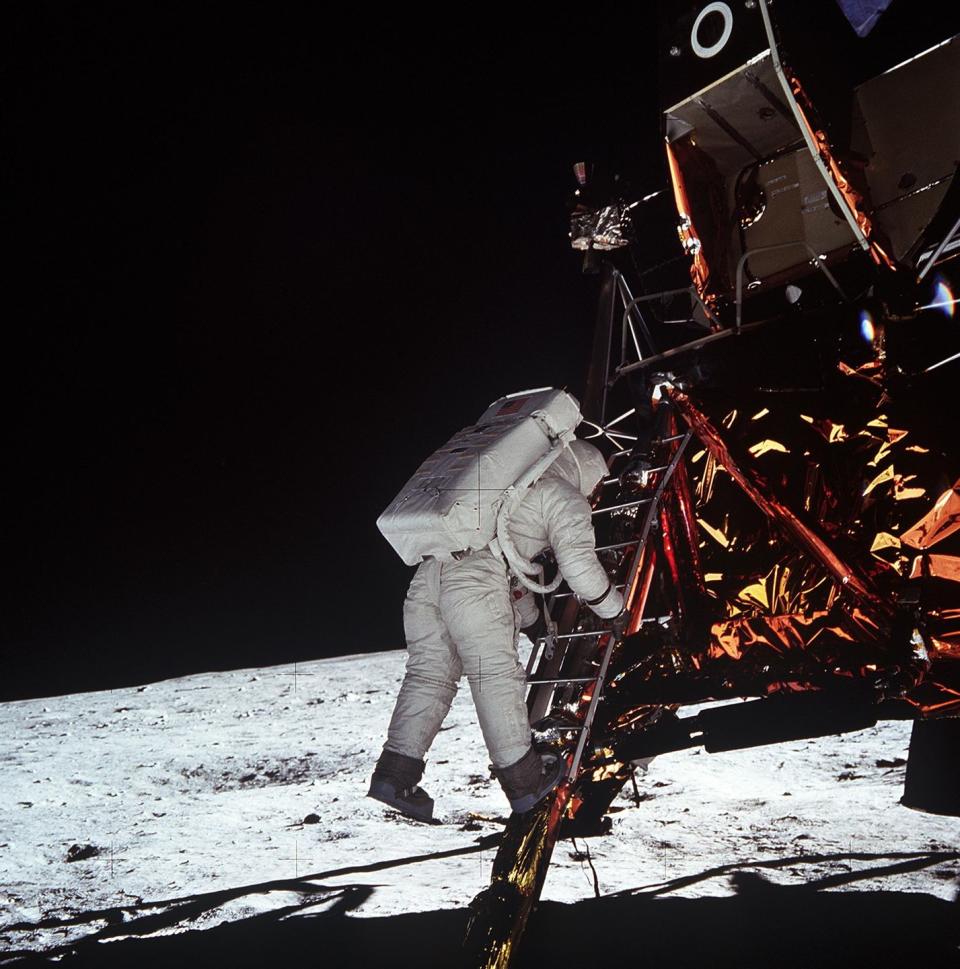 <p>Aldrin descends the steps of the Lunar Module ladder as he prepares to walk on the Moon.</p>