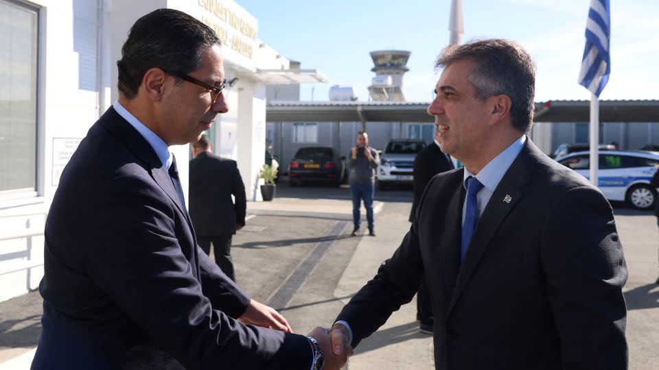 Cyprus' Foreign Minister Constantinos Kombos welcomes his Israeli counterpart Eli Cohen in Larnaca, Cyprus, on December 20. - Stavros Ioannides/PIO/Reuters