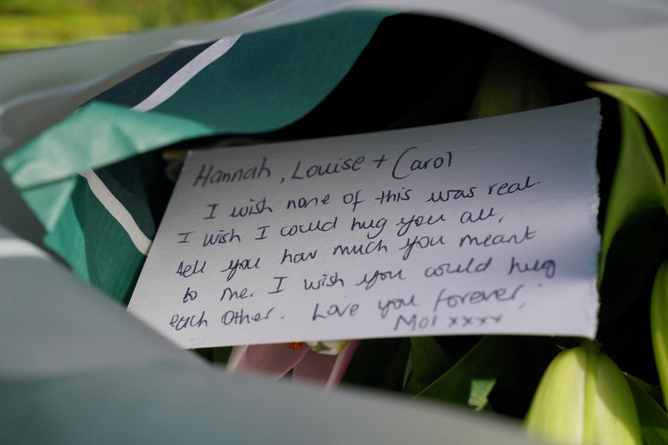A message on a floral tribute near to the scene in Ashlyn Close, Bushey, Hertfordshire