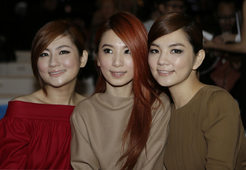From left , Ella Chen, Hebe Tien and Selina Jen of the Taiwanese pop group S.H.E., pose prior to the start of the the Gucci women's Spring-Summer 2013 collection that was presented in Milan, Italy, Wednesday, Sept.19, 2012. (AP Photo/Luca Bruno)
