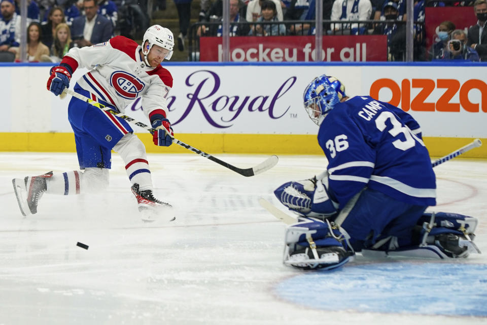 Montreal Canadiens defenseman Brett Kulak (77) is stopped by Toronto Maple Leafs goaltender Jack Campbell (36) during the first period of an NHL hockey game Wednesday, Oct. 13, 2021, in Toronto. (Evan Buhler/The Canadian Press via AP)