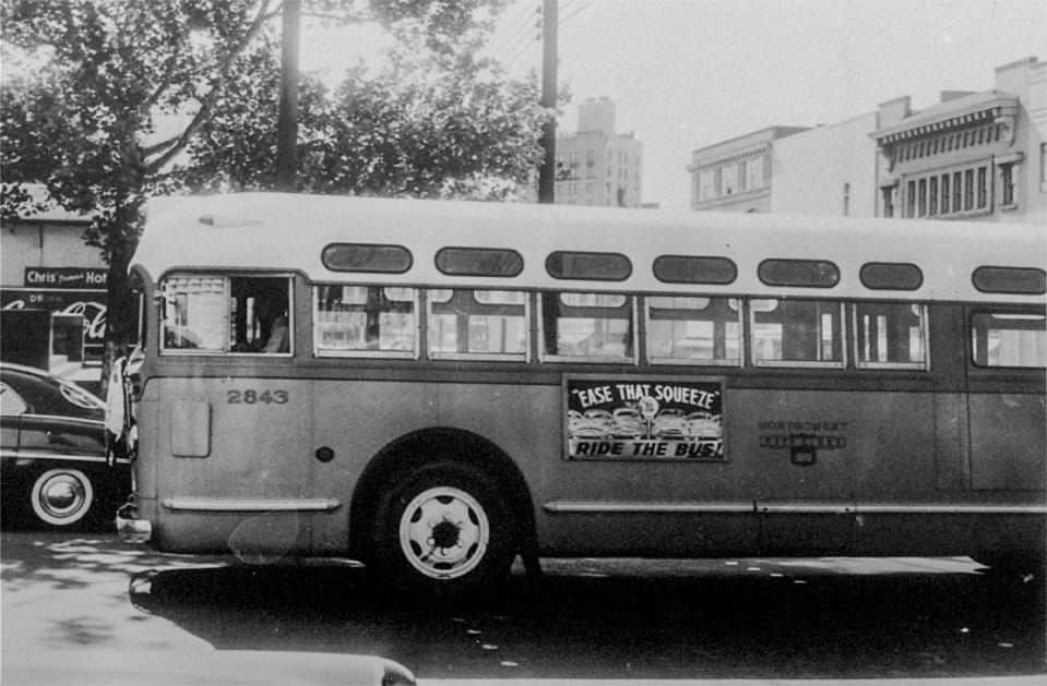 A driver rides alone as his empty bus moves through downtown Montgomery, Ala., April 26, 1956, during the bus boycott.