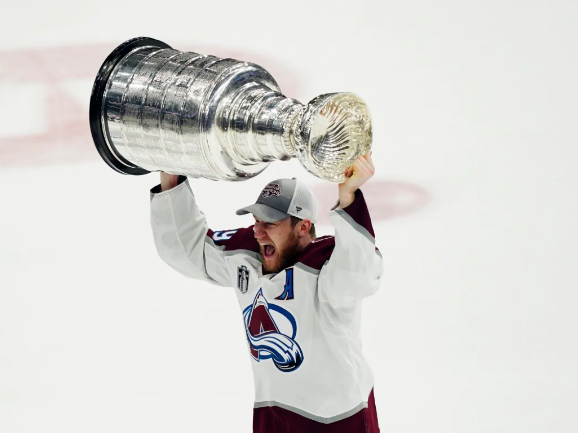 Nathan MacKinnon lifts the Stanley Cup following the Colorado Avalanche win over the Tampa Bay Lightning in game six of the Stanley Cup final.  (John Bazemore/The Associated Press - image credit)