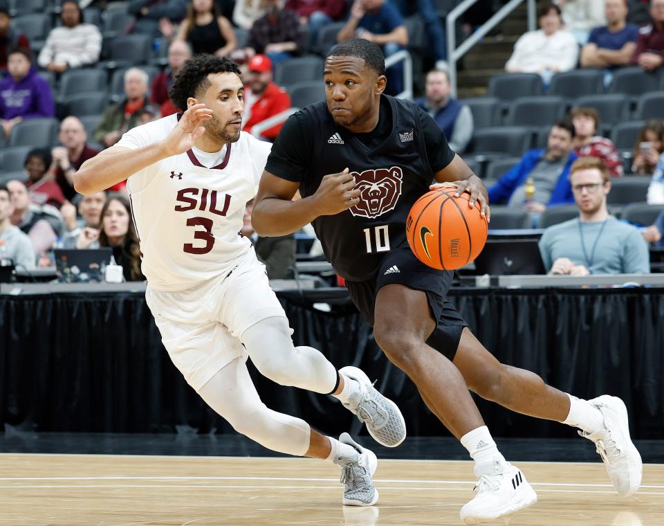 Missouri State's Damien Mayo Jr. (10) moves the ball during a Missouri Valley Conference Tournament game against Southern Illinois, Friday, March 3, 2023, at Enterprise Center in St. Louis. 