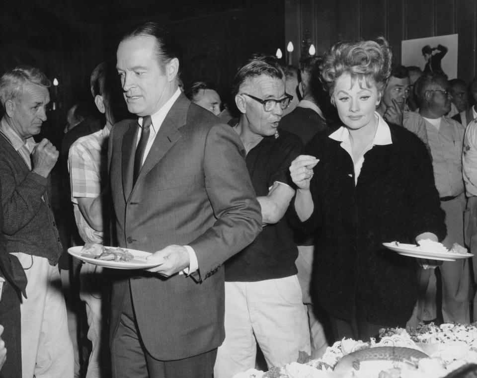 <p>Lucille and Bob Hope make their way through the set's catering buffet line, while filming <em>Critic's Choice </em>in 1963. </p>