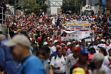 Elderly protesters take part in a march for peace in downtown Caracas February 23, 2014. REUTERS/Tomas Bravo