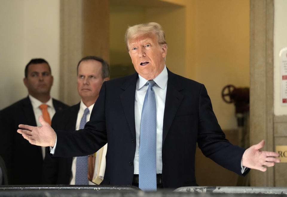 Former President Donald Trump comments to the media during a break of his civil business fraud trial at New York Supreme Court, Wednesday, Oct. 18, 2023, in New York. (AP Photo/Seth Wenig)
