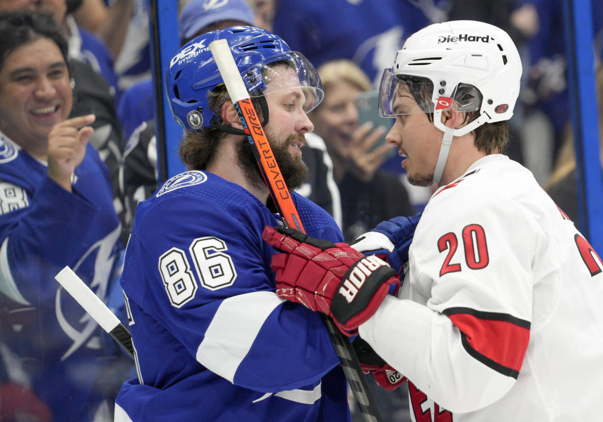 TAMPA, FL - JUNE 03: Tampa Bay Lightning right wing Nikita Kucherov (86) and Carolina Hurricanes right wing Sebastian Aho (20) have words during the NHL Hockey 2nd round Stanley Cup match between the Tampa Bay Lightning and Carolina Hurricanes on June 3, 2021 at Amalie Arena in Tampa, FL. (Photo by Andrew Bershaw/Icon Sportswire via Getty Images)