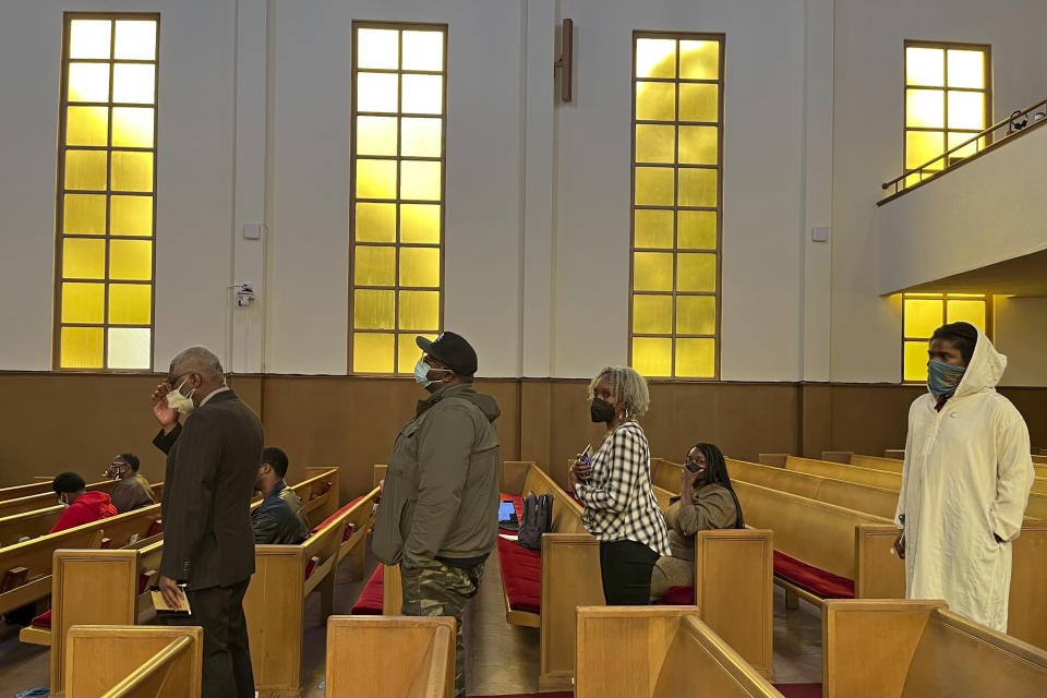 People line up to speak during a reparations task force meeting at Third Baptist Church in San Francisco, Wednesday, April 13, 2022. California's first-in-the-nation reparations task force met for the first time since its inaugural meeting nearly a year ago. The live meeting also comes mere weeks after the group voted to limit restitution to descendants of enslaved or free Black people in the U.S. before the 20th century. (AP Photo/Janie Har)