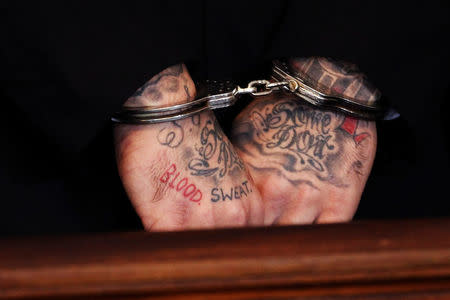 The words 'blood' and 'sweat' are seen tattooed on the hands of former Aaron Hernandez. REUTERS/Dominick Reuter