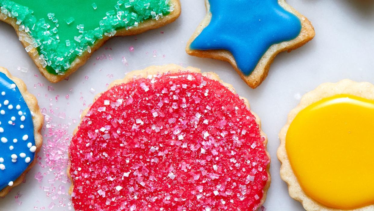vegan sugar cookies iced and topped with sprinkles