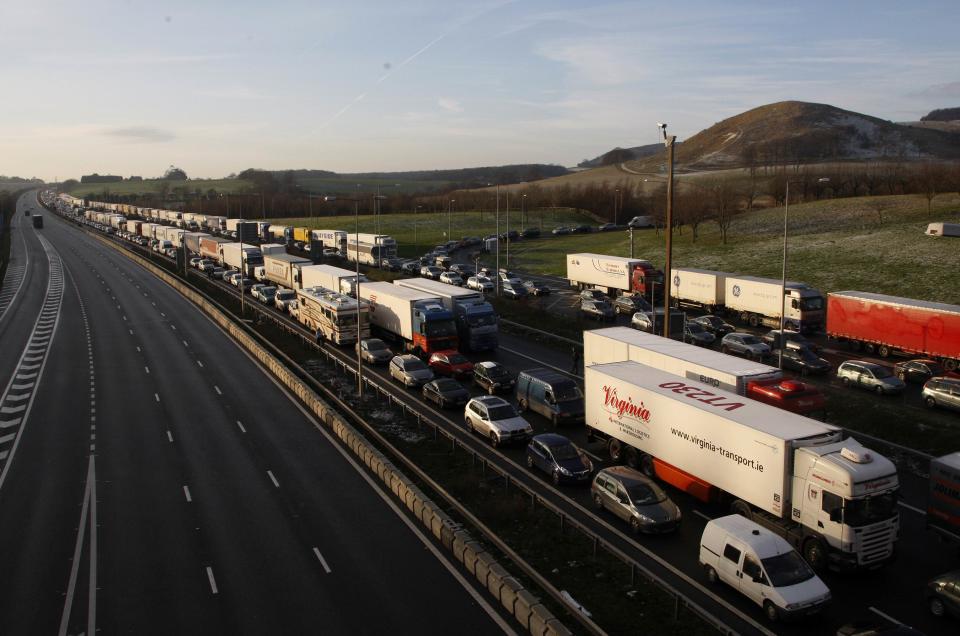 Traffic queues on the M20 motorway and the slip road leading to the Channel Tunnel Terminal, near Folkestone in Kent, southern England December 19, 2009. Rail operator Eurostar cancelled all its services on Saturday because of bad weather, after four trains broke down due to freezing weather conditions, trapping about 2,500 passengers overnight in the undersea Channel Tunnel linking France and Britain   REUTERS/Luke MacGregor (BRITAIN - Tags: ENVIRONMENT TRANSPORT TRAVEL IMAGES OF THE DAY)