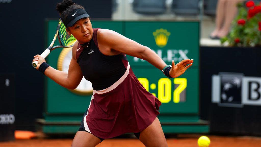 Naomi Osaka goes to strike the ball at the Italian Open 