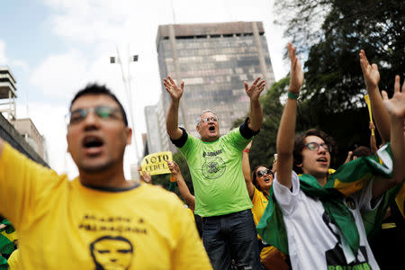 Supporters of Jair Bolsonaro, far-right lawmaker and presidential candidate of the Social Liberal Party (PSL), shout slogans during a demonstration in Sao Paulo, Brazil, October 21, 2018. REUTERS/Nacho Doce