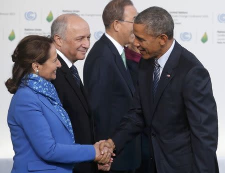 U.S. President Barack Obama (R) is welcomed by French Ecology Minister Segolene Royal (L) and French Foreign Affairs Minister Laurent Fabius, President-designate of COP21, as he arrives for the opening day of the World Climate Change Conference 2015 (COP21) at Le Bourget, near Paris, France, November 30, 2015. REUTERS/Christian Hartmann