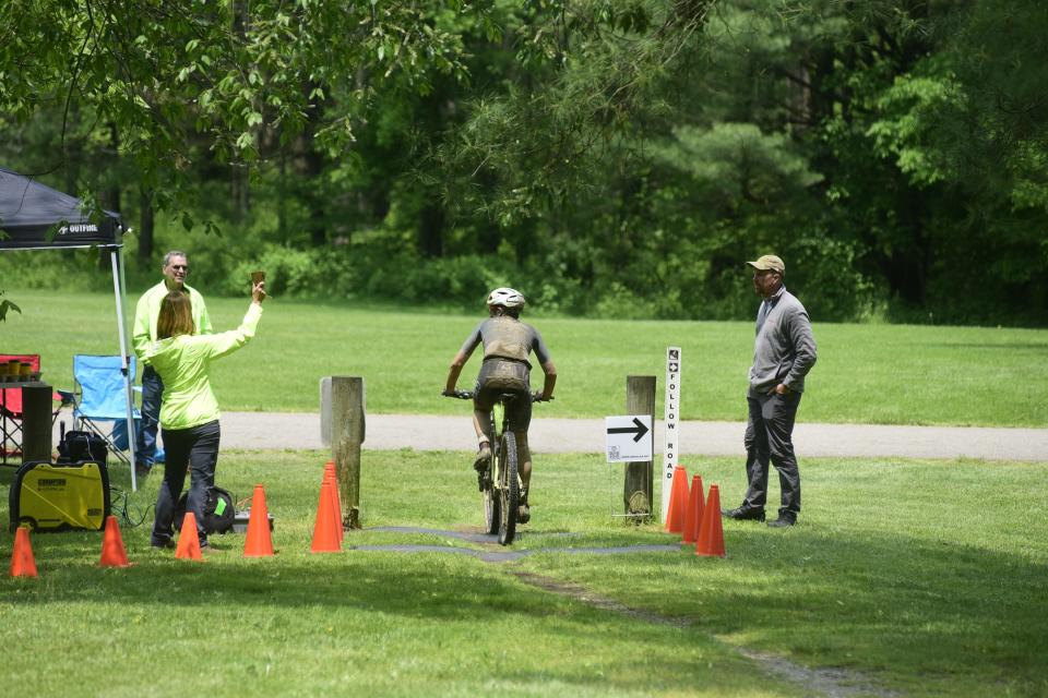A racer bikes through a checkpoint at Mohican State Park on Saturday during the Mohican Mountain Bike races.