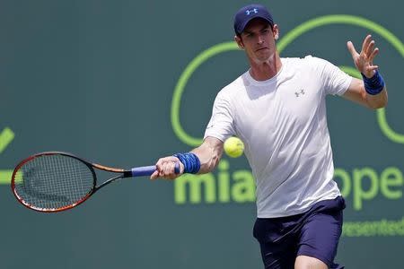 Mar 27, 2015; Key Biscayne, FL, USA; Andy Murray hits a forehand against Donald Young (not pictured) on day five of the Miami Open at Crandon Park Tennis Center. Murray won 6-4, 6-2. Mandatory Credit: Geoff Burke-USA TODAY Sports