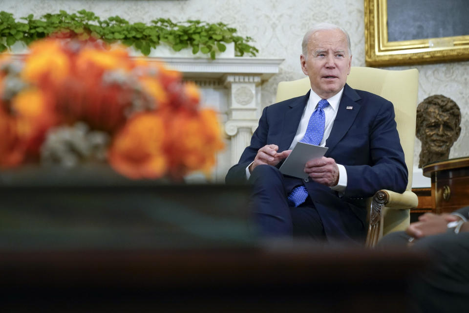 President Joe Biden speaks in the Oval Office of the White House, Monday, April 24, 2023, in Washington, as he and Vice President Kamala Harris meet with the three Tennessee state lawmakers who faced expulsion for participating in gun control protests at their statehouse. (AP Photo/Andrew Harnik)