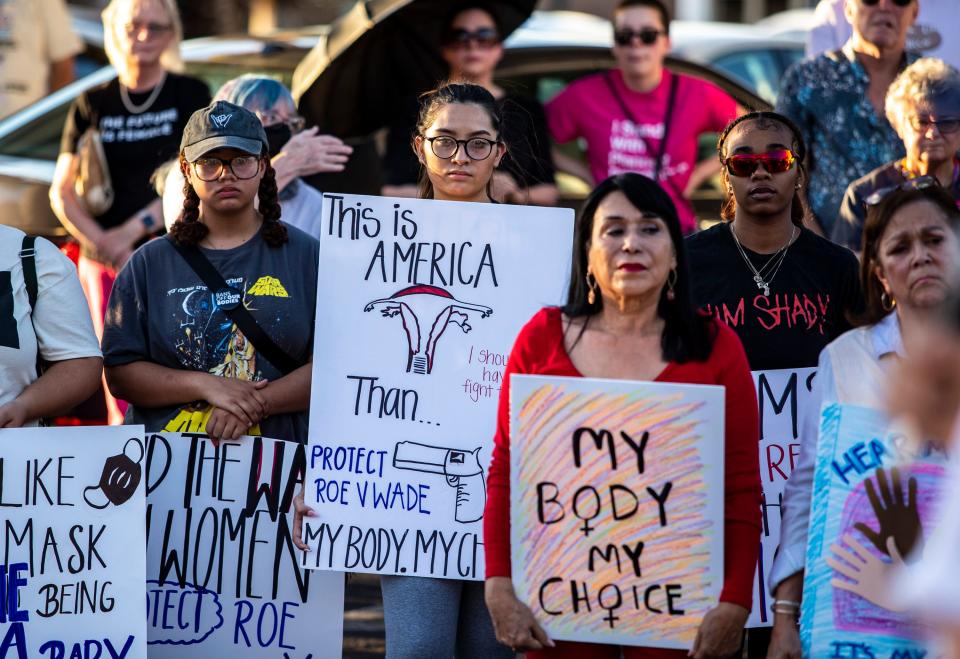 Samantha Rodriguez of Desert Hot Springs holds up a sign in support of abortion rights while listening to speakers during a rally organized by Courageous Resistance of the Desert in front of the Palm Springs Courthouse in Palm Springs, Calif., Friday, June 24, 2022. 