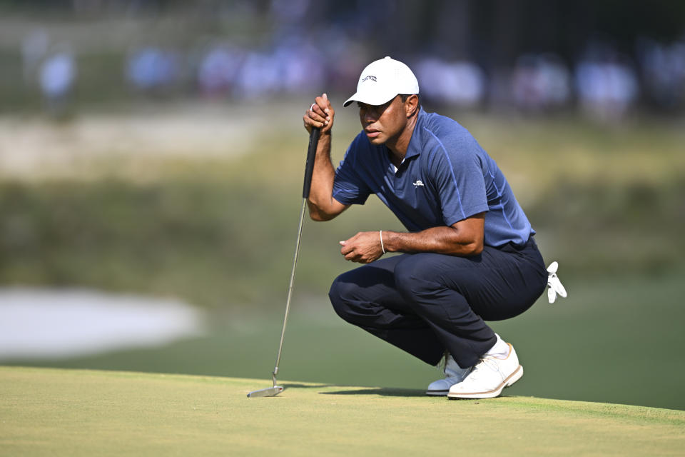 PINEHURST, NORTH CAROLINA - JUNE 14: Tiger Woods lines up his putt at the 13th green during the second round of 124th U.S. Open Championship at Pinehurst No. 2 at Pinehurst Resort on June 14, 2024 in Pinehurst, North Carolina. (Photo by Tracy Wilcox/PGA TOUR via Getty Images)