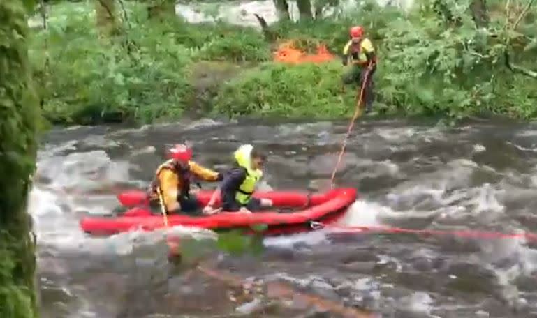 In total 30 rescuers helped retrieve the stranded friends using a boat (Picture: Devon & Somerset Fire & Rescue Service)