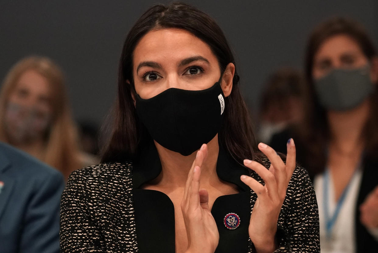 U.S. Rep. Alexandria Ocasio-Cortez attends a session inside the venue of the COP26 U.N. Climate Summit in Glasgow, Scotland, Tuesday, Nov. 9, 2021. The U.N. climate summit in Glasgow has entered it's second week as leaders from around the world, are gathering in Scotland's biggest city, to lay out their vision for addressing the common challenge of global warming. (AP Photo/Alberto Pezzali)