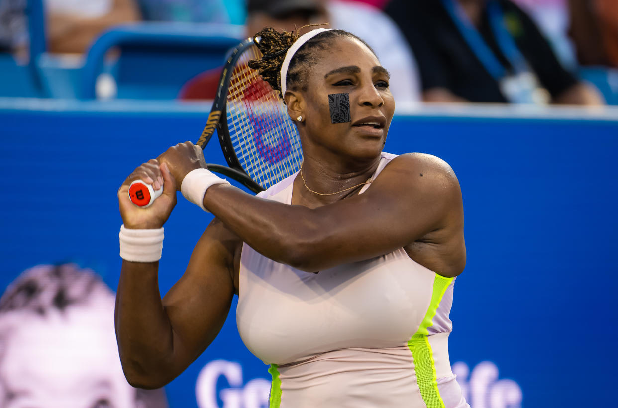 MASON, OHIO - AUGUST 16:  Serena Williams of the United States hits a shot against Emma Raducanu of Great Britain in her first round match on Day 4 of the Western & Southern Open at Lindner Family Tennis Center on August 16, 2022 in Mason, Ohio (Photo by Robert Prange/Getty Images)