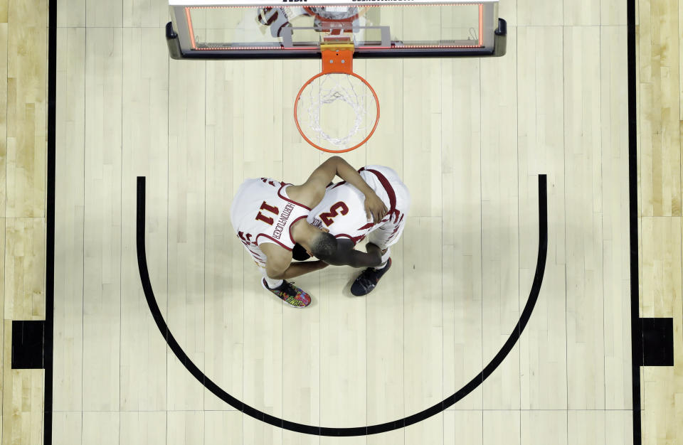 Iowa State's Talen Horton-Tucker (11) consoles teammate Marial Shayok (3) after a 62-59 loss to Ohio State during a first round men's college basketball game in the NCAA Tournament Friday, March 22, 2019, in Tulsa, Okla. (AP Photo/Jeff Roberson)