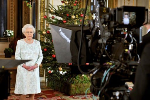 Queen Elizabeth II records her Christmas message to the Commonwealth which is to be broadcast in 3D for the first time, at Buckingham Palace in London on December 23, 2012. She will pay tribute to the London 2012 athletes in her annual Christmas message to the Commonwealth, saying they had inspired the world and drawn people in to the excitement and drama