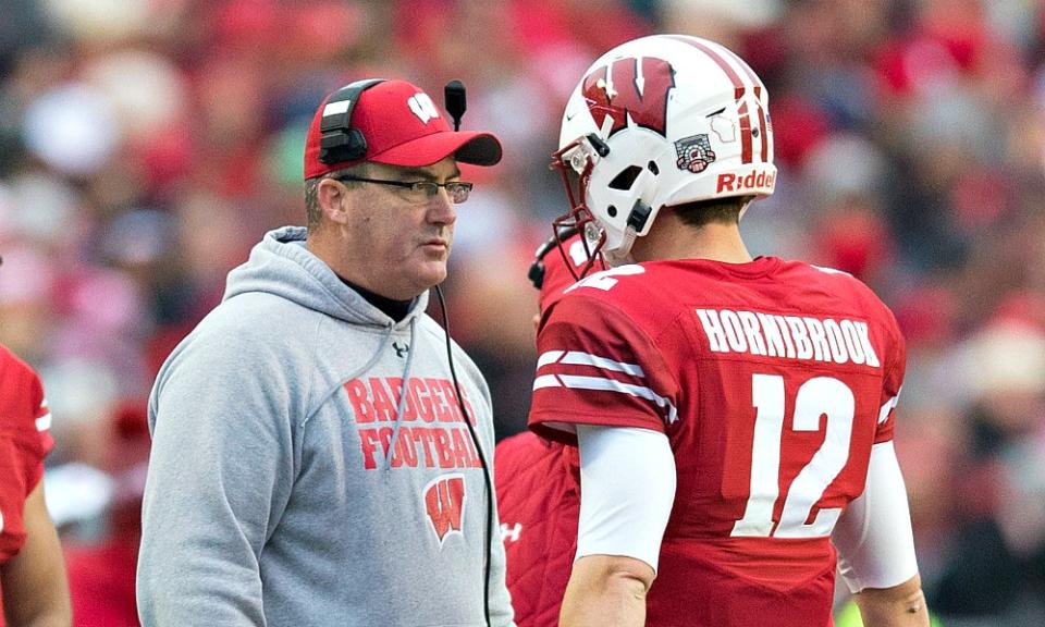 Nov 18, 2017; Madison, WI, USA; Wisconsin Badgers head coach Paul Chryst talks with quarterback Alex Hornibrook (12) during the second quarter against the <a class="link " href="https://sports.yahoo.com/ncaaf/teams/michigan/" data-i13n="sec:content-canvas;subsec:anchor_text;elm:context_link" data-ylk="slk:Michigan Wolverines;sec:content-canvas;subsec:anchor_text;elm:context_link;itc:0">Michigan Wolverines</a> at Camp Randall Stadium. Mandatory Credit: Jeff Hanisch-USA TODAY Sports