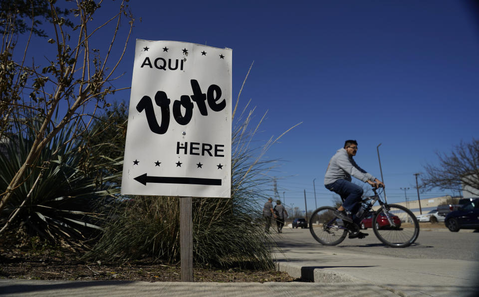 FILE - Voters leave an early voting poll site, Feb. 14, 2022, in San Antonio. (AP Photo/Eric Gay, File)