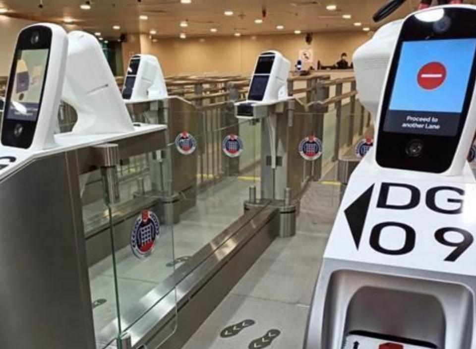 Iris and facial scanners at immigration checkpoints in Singapore.