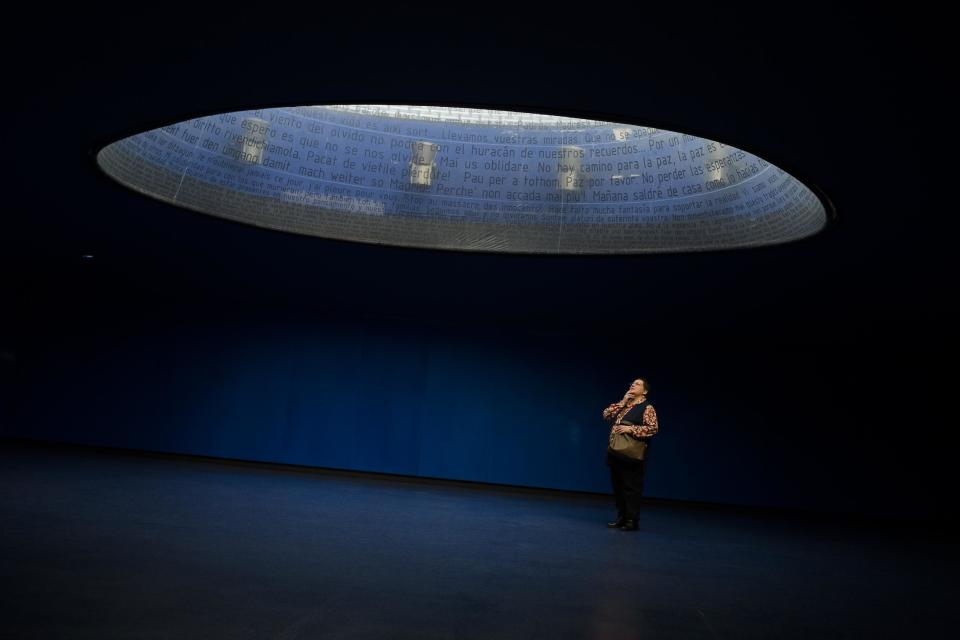 A woman visits the Atocha Bombing Memorial, in Madrid, Spain, Tuesday March 11, 2014, in remembrance of those killed and injured in the Madrid train bombings marking the 10th anniversary of Europe's worst Islamic terror attack. The attackers targeted four commuter trains with 10 shrapnel-filled bombs concealed in backpacks during morning rush hour on March 11, 2004. (AP Photo/Andres Kudacki)