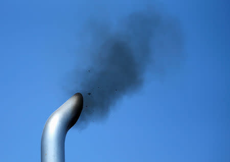 FILE PHOTO: A truck engine is tested for pollution exiting its exhaust pipe as California Air Resources field representatives (unseen) work a checkpoint set up to inspect heavy-duty trucks traveling near the Mexican-U.S. border in Otay Mesa, California September 10, 2013. REUTERS/Mike Blake/File Photo