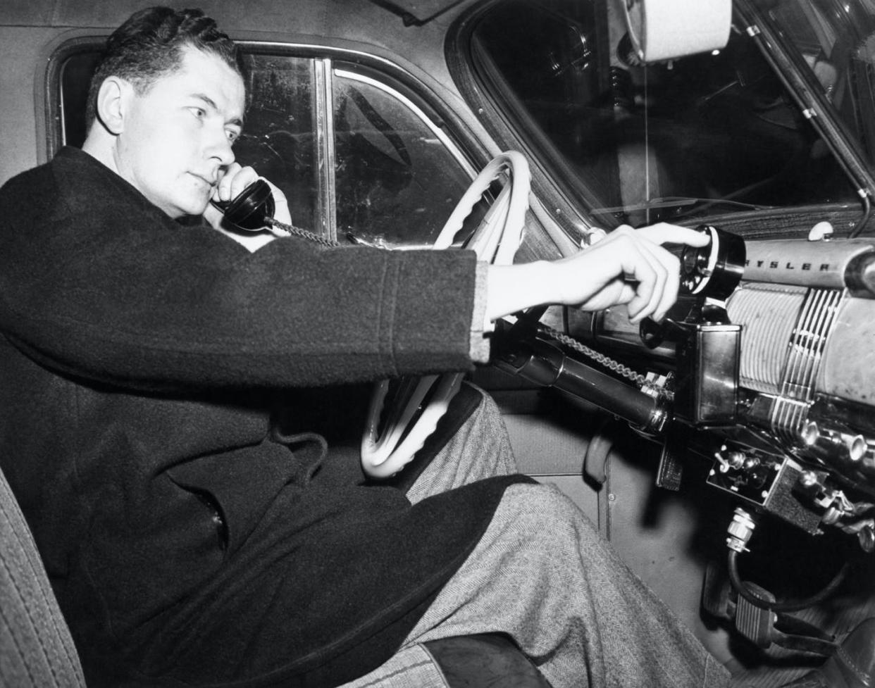 <span class="caption">An engineer demonstrates a car phone five months before the historic first call on a competing company's commercial mobile telephone service in 1946.</span> <span class="attribution"><a class="link " href="https://www.gettyimages.com/detail/news-photo/frederick-t-budelman-chief-engineers-of-the-fred-m-link-news-photo/515384226" rel="nofollow noopener" target="_blank" data-ylk="slk:Bettmann via Getty Images;elm:context_link;itc:0;sec:content-canvas">Bettmann via Getty Images</a></span>