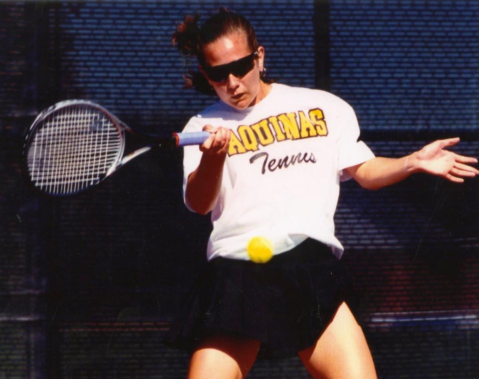 Aquinas' Celena McCoury went unbeaten in 1996, winning a Division II state singles championship and leading the Knights to the team title.