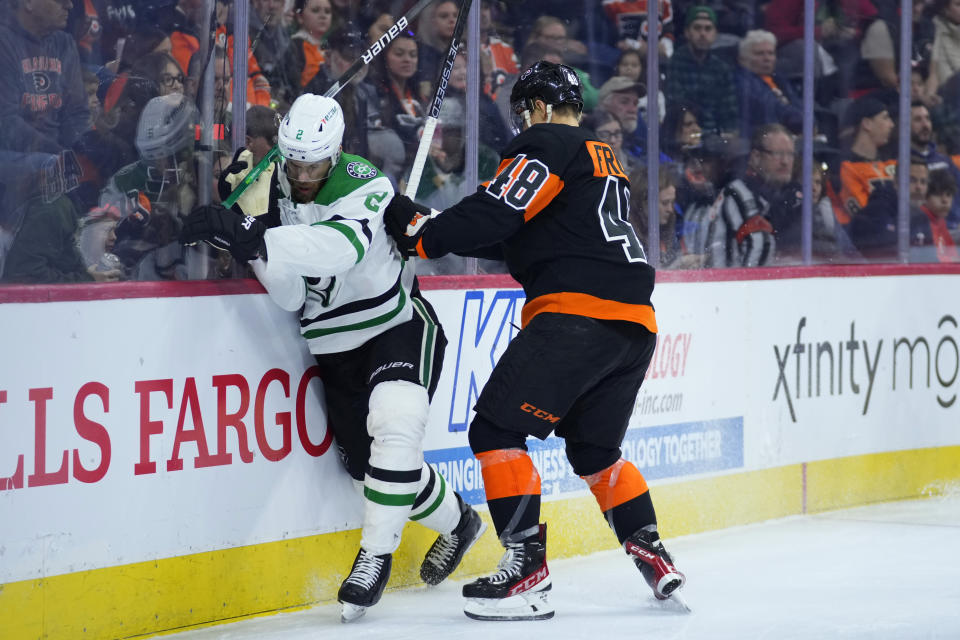 Dallas Stars' Jani Hakanpaa, left, and Philadelphia Flyers' Morgan Frost collide during the second period of an NHL hockey game, Sunday, Nov. 13, 2022, in Philadelphia. (AP Photo/Matt Slocum)