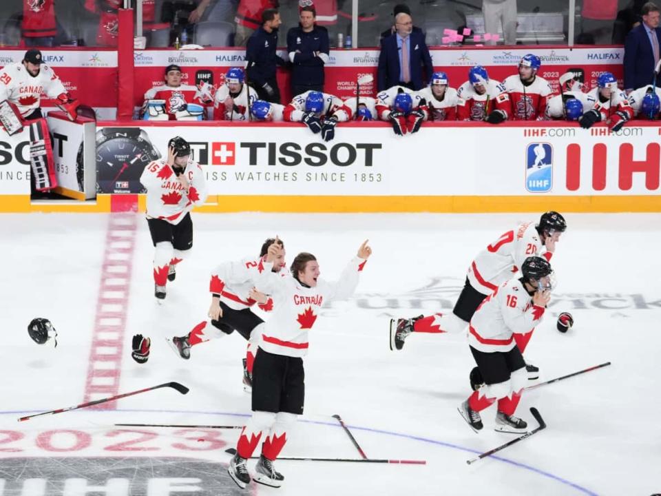 Team Canada celebrates winning the gold medal over Czechia during overtime of the IIHF World Junior Hockey Championship gold medal game in Halifax on Thursday, January 5, 2023.  (Darren Calabrese/The Canadian Press - image credit)