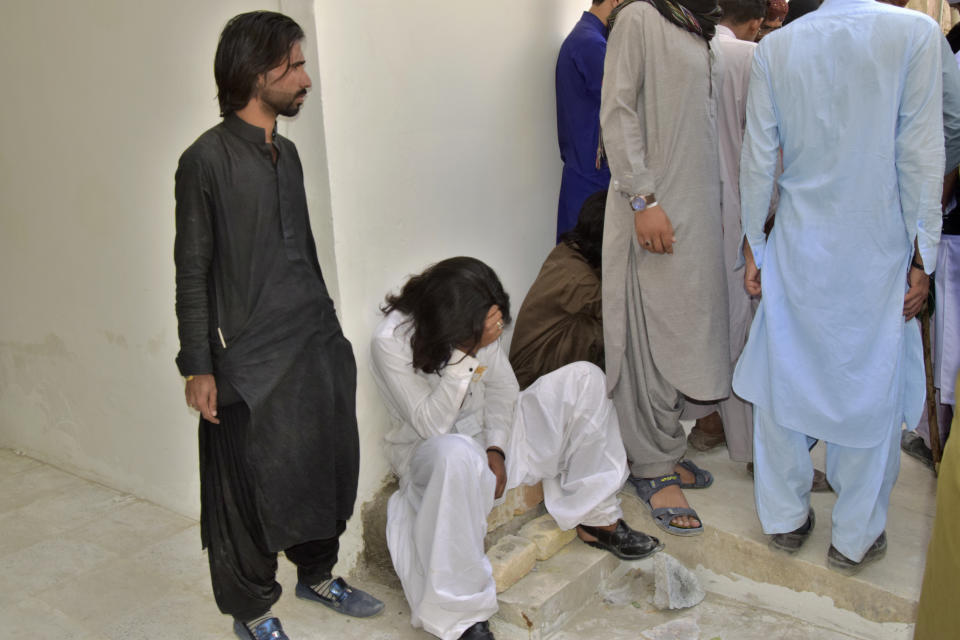 A man mourns for his relative, who was killed in a bomb explosion, at a hospital, in Quetta, Pakistan, Friday, Sept. 29, 2023. A powerful bomb exploded at a rally celebrating the birthday of Islam's Prophet Muhammad in southwest Pakistan on Friday, killing multiple people and wounding dozens of others, police and a government official said. (AP Photo/Arshad Butt)